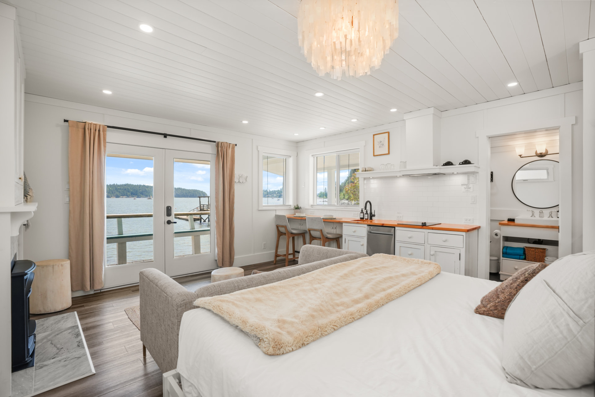 A bedroom suite opening onto the water