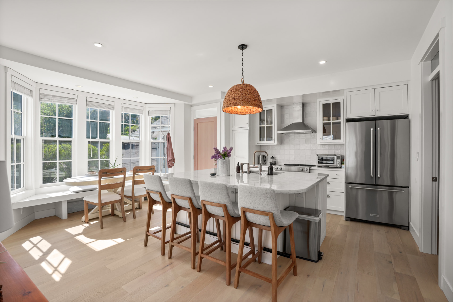 A bright kitchen and dining space with morning light